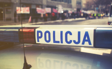 detail of a police (Policja) car in Poland, demonstration in bac © irontrybex