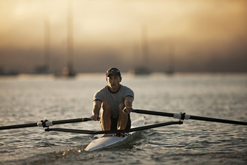 Mid-adult man sea rowing