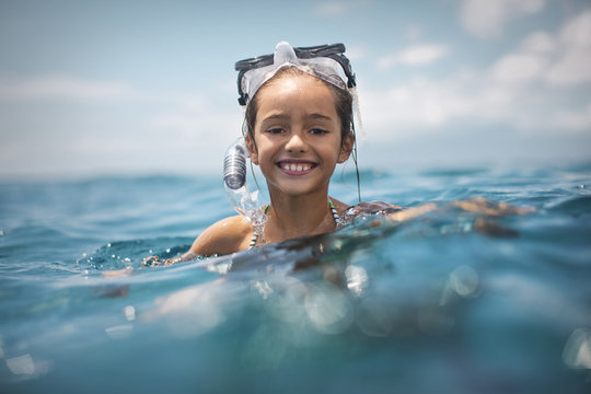 Girl snorkeling in sea