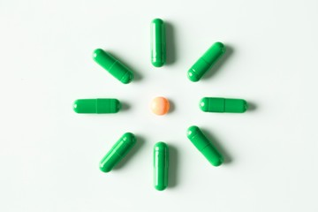 medical pills and capsules pattern on white background. flat lay, top view.