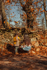 Portrait woman and girl admiring and enjoying nature. Autumn lan