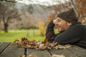 Side face close up portrait smiling man with wool hat