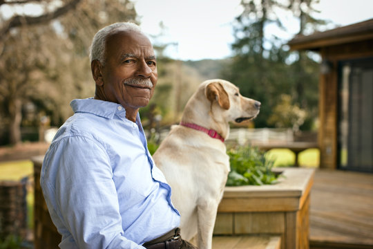 Portrait of senior man and his dog.