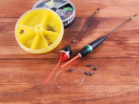 Fishing accessories - sinkers, floats and round boxes.