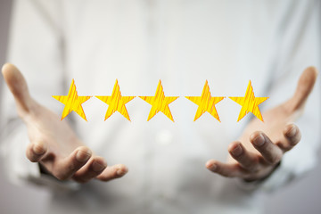 Businessman touching technology interface with ranking stars