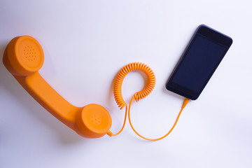 Orange analog phone and smartphone