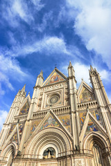 Fototapeta na wymiar The Cathedral Duomo of Orvieto and blue sky. Umbria, Italy