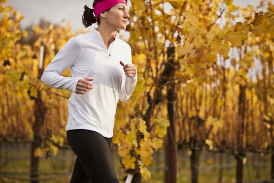 Mid-adult woman jogging in the park.
