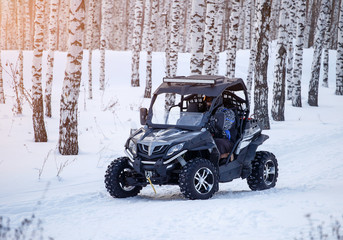 ATV in the winter forest