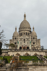 PARIS, FRANCE - DECEMBER 25, 2015:  Sacre Coeur Basilica in winter day. Large medieval cathedral. Basilica of Sacred Heart. 