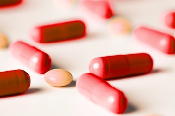 medical pills and capsules pattern on white background. flat lay, top view.