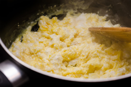 Freshly prepared scrambled eggs in pan