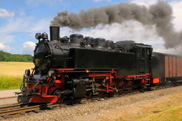 Fototapeta na wymiar steam train on island Rugen in Germany