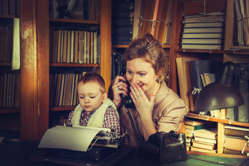 Mother with her son sitting in the library.