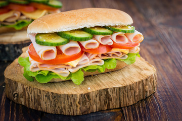 Turkey Ham Sandwich With Cheese, Tomatoes, Cucumbers and Salad