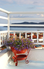 Fototapeta na wymiar Beautiful Greek terrace with flowers