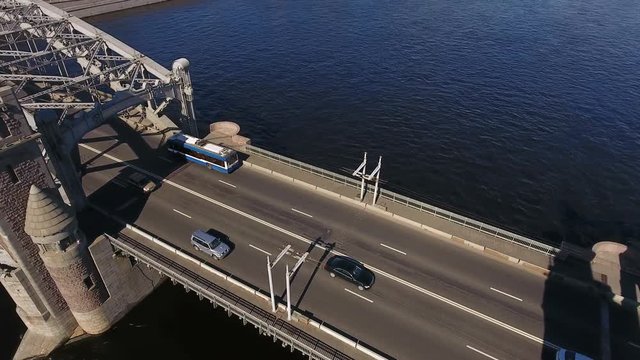 Top view at the central drawn span of the Bolsheokhtinsky bridge with vehicles driving on road. The Neva river, St. Petersburg, Russia

