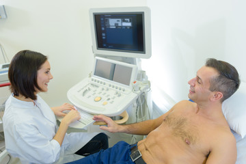 Patient having scan talking to nurse