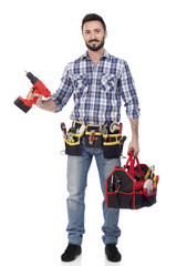 Carpenter with toolbox and drill