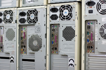 Rows of back lanes of standard desktop computers with various connectors