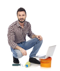 House painter with laptop