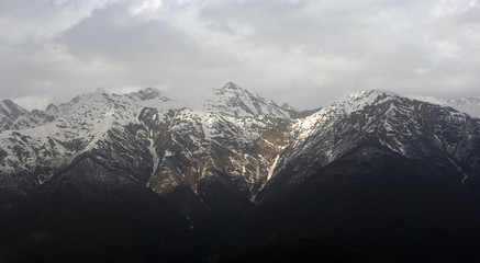 View of Caucasus mountains covered with snow caps
