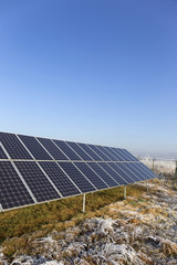 Solar Power Station in the snowy freeze winter Nature