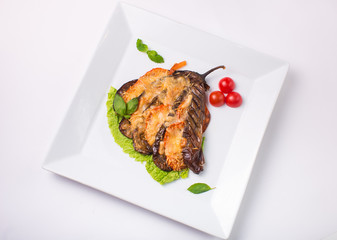 eggplant baked with cheese on white background