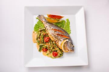 dorado fish baked with greens and green beans