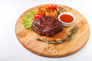 ribeye steak grilled with rosemary on a wooden