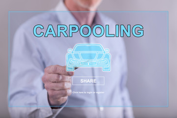 Man touching a carpooling concept on a touch screen