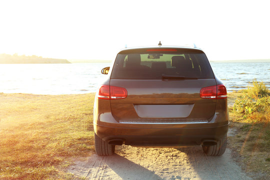 Fototapeta Car on parked river shore