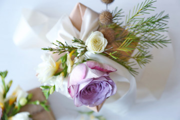 Box decorated with flowers on light background, top view