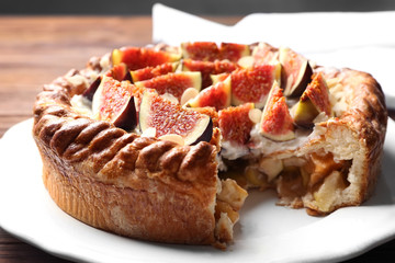 Fresh cake with figs on plate closeup
