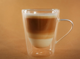 Cup of coffee on beige background