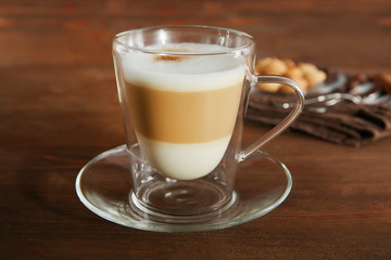 Cup of coffee on wooden background