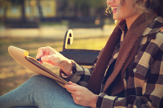 Close Up View Of Female Artist Drawing Sketch Outdoors