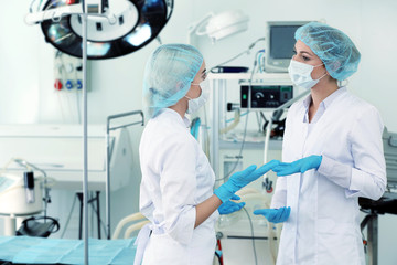 Young doctors in operating room of modern clinic