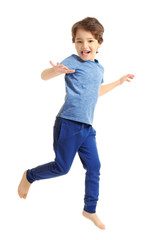 Cute emotional little boy jumping on white background