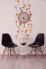 Interior of beautiful living room decorated with flowers
