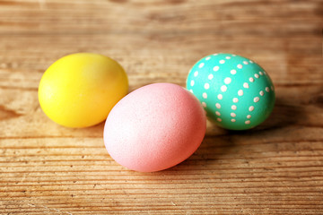 Fototapeta na wymiar Colourful Easter eggs on wooden background