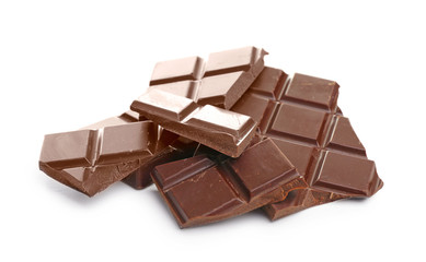 Broken dark chocolate pieces on white background