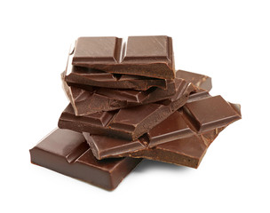Broken dark chocolate pieces on white background