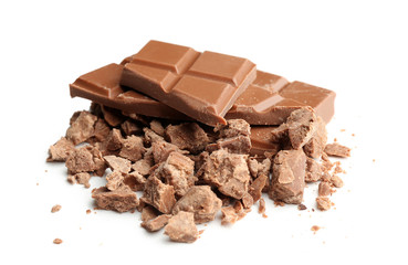 Broken milk chocolate pieces with morsels on white background