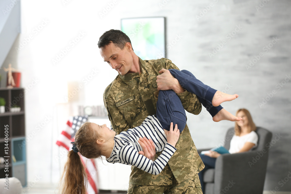 Canvas Prints soldier in camouflage playing with his daughter at home