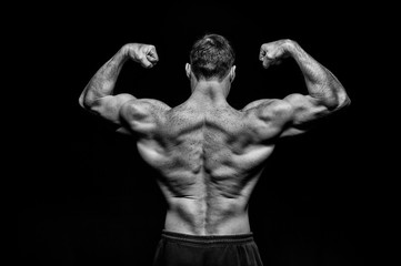 Fototapeta na wymiar handsome bodybuilder man with muscular body training and posing
