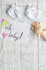 birth of child - baby shower concept on wooden background