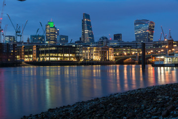Fototapeta na wymiar LONDON, ENGLAND - JUNE 18 2016: Night Photo of Thames River and skyscrapers, London, Great Britain