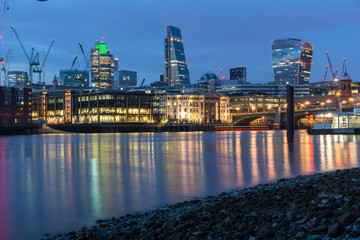 Fototapeta premium LONDON, ENGLAND - JUNE 18 2016: Night Photo of Thames River and skyscrapers, London, Great Britain