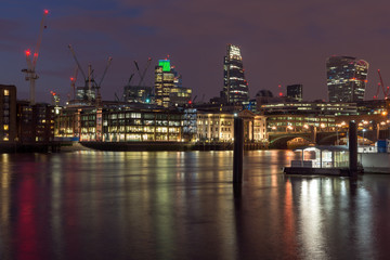 Fototapeta na wymiar LONDON, ENGLAND - JUNE 18 2016: Night photo of Millennium Bridge, Thames River and St. Paul Cathedral, London, Great Britain
